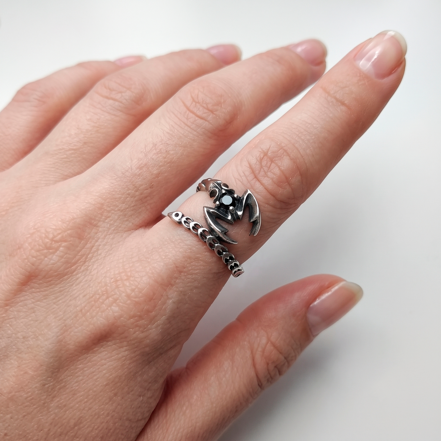 Close-up of adjustable Scorpio sterling silver ring on a man's pinky finger