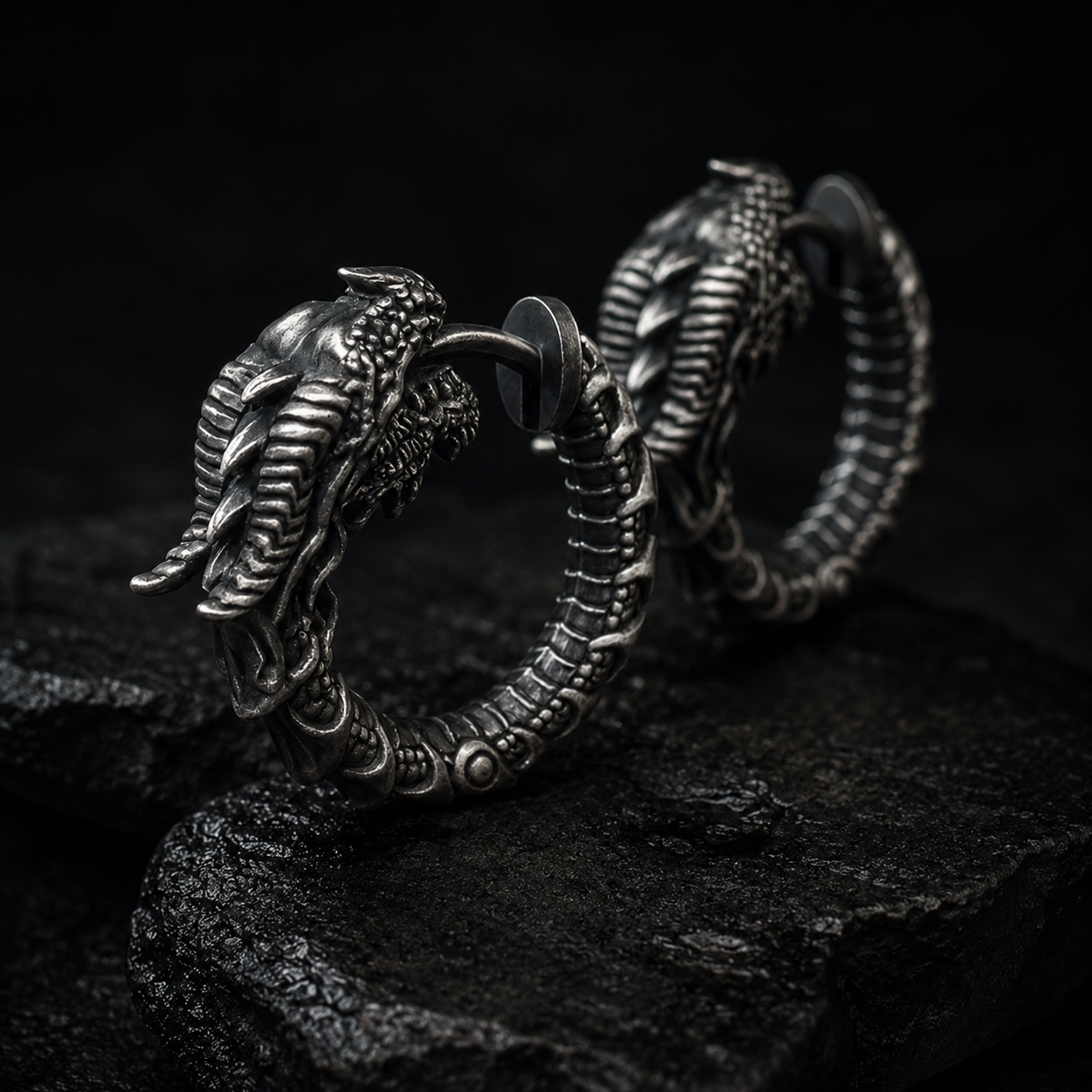 Earrings collection by Indigo Jewelry featuring handcrafted oxidized sterling silver statement earrings with symbolic design and refined detail. Premium silver earrings inspired by individuality, craftsmanship and timeless expression.
