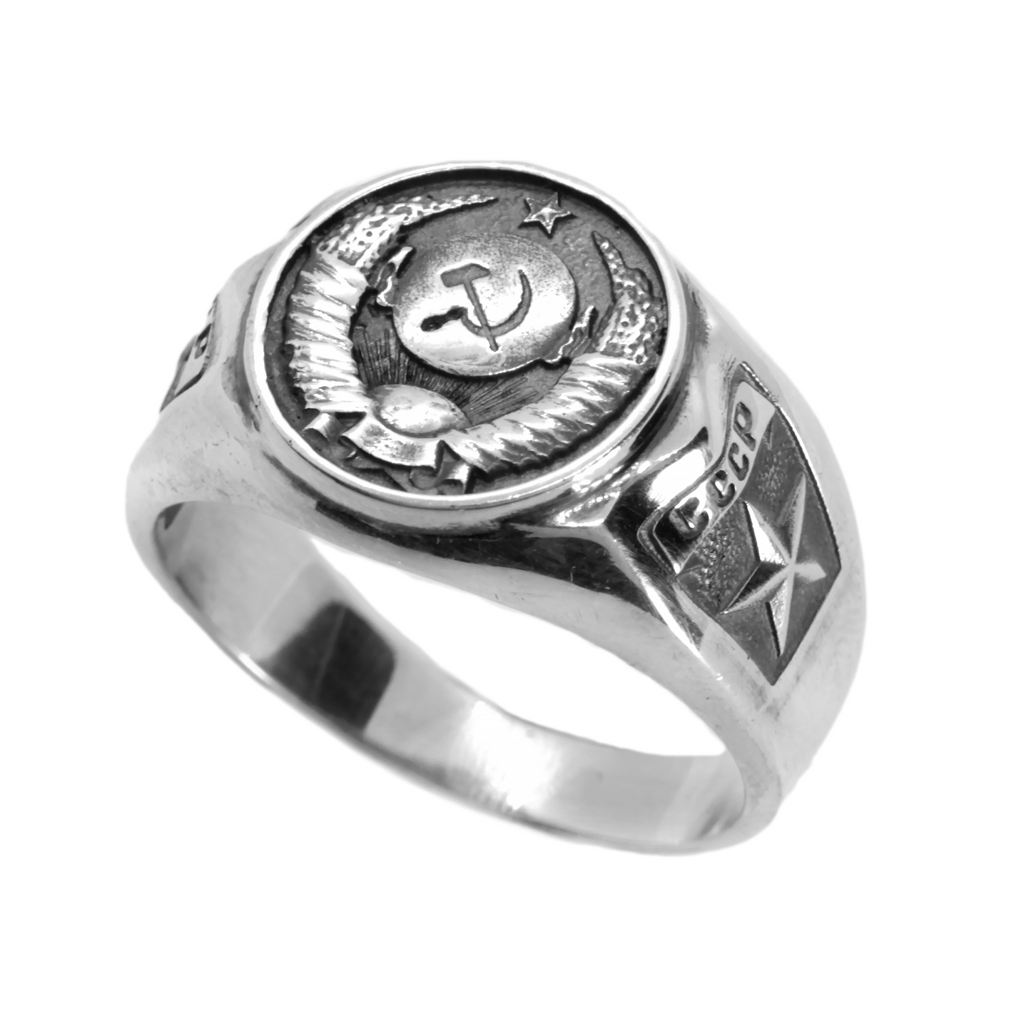 A silver ring with a circular emblem featuring a hammer and sickle symbol, which is a common emblem associated with the Soviet Union.