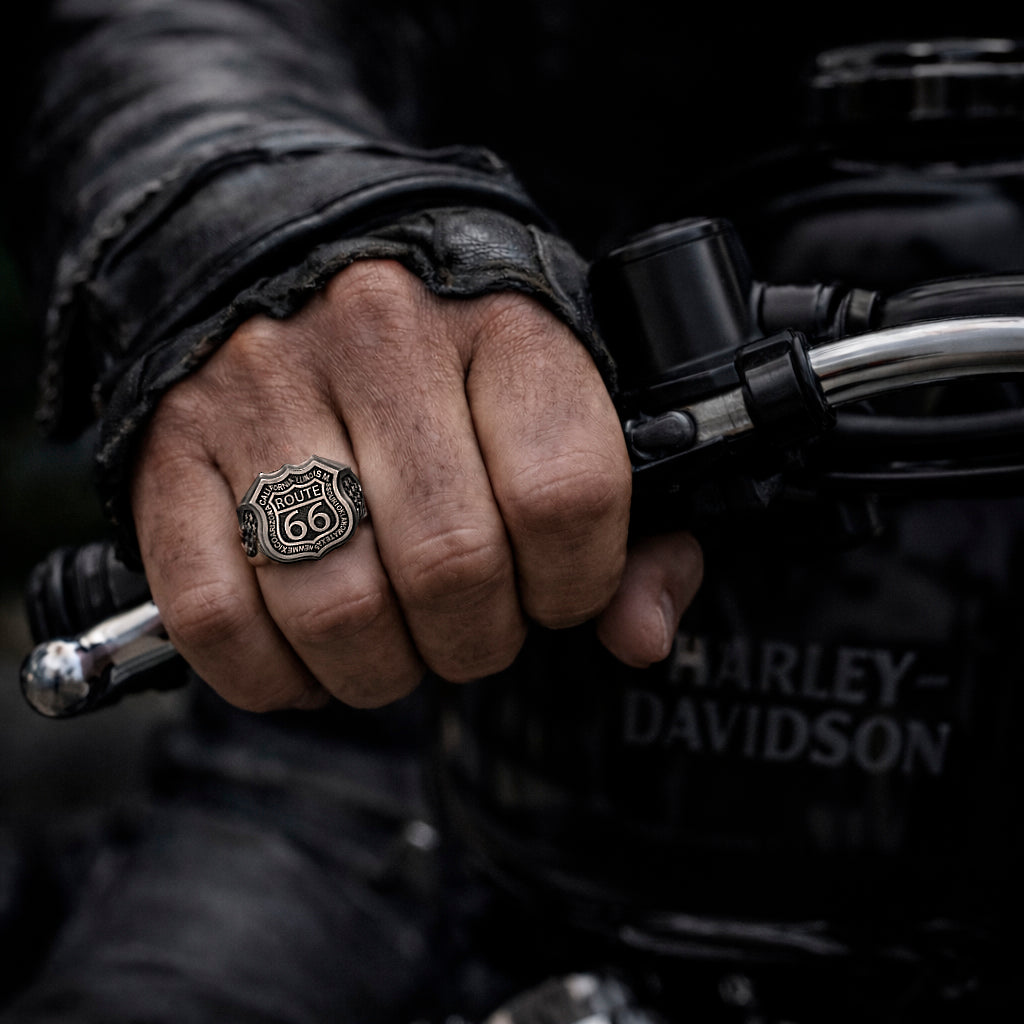 Route 66 sterling silver ring by Indigo Jewelry, men’s biker statement ring crafted from solid 925 silver with oxidized finish. Detailed Route 66 shield engraving with surrounding state names, bold vintage motorcycle jewelry design. Masculine rock style ring inspired by American highway culture, handcrafted silver band for riders, travelers, and lovers of road symbolism.
