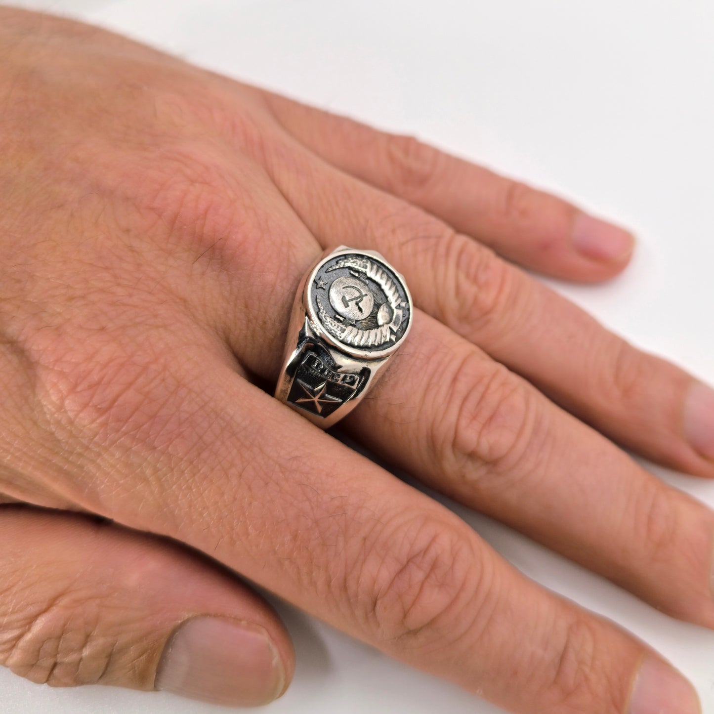 The State Emblem of the USSR, Emblem of the Soviet Union, Sterling Silver Ring. Coat of arms of the Soviet Union" Big sterling silver signet with round top. This design was fixed in the 1924 Soviet Constitution: "The State Emblem of the USSR is composed of a sickle and a hammer on a globe depicted in the rays of the sun and framed by ears of wheat, with the inscription "proletarians of the world, unite!".