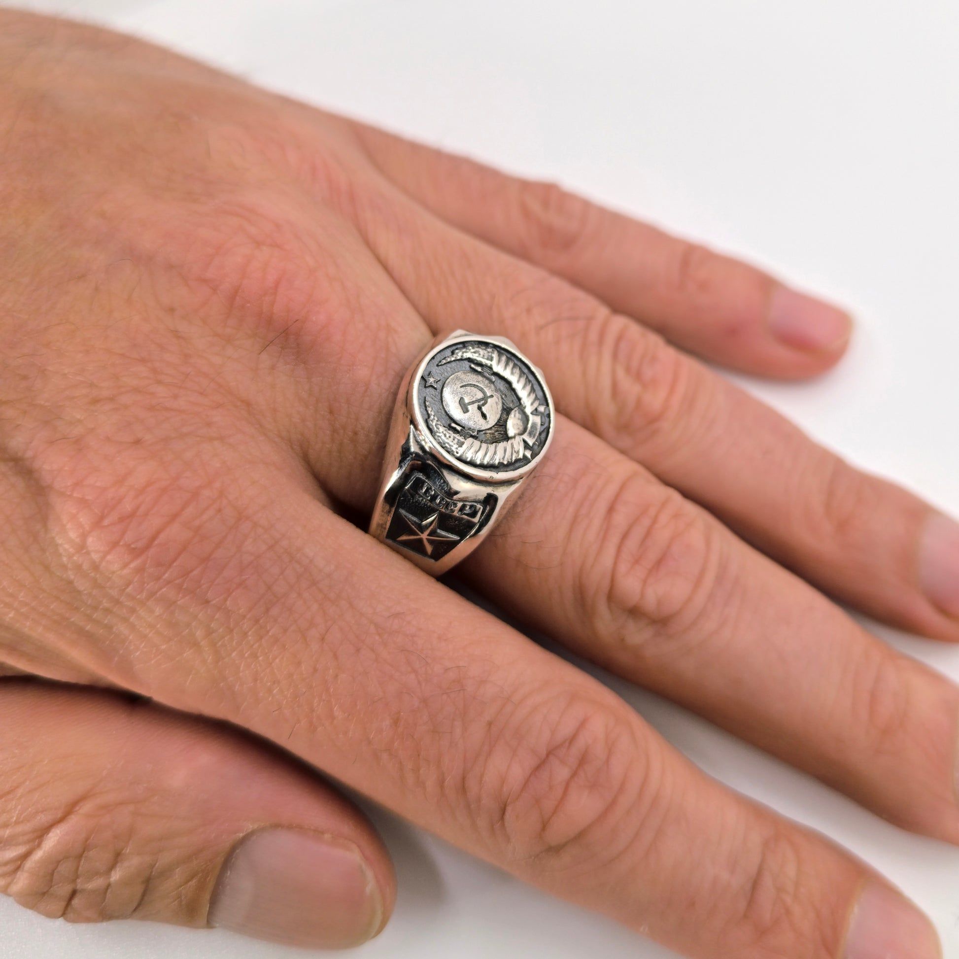 The State Emblem of the USSR, Emblem of the Soviet Union, Sterling Silver Ring. Coat of arms of the Soviet Union" Big sterling silver signet with round top. This design was fixed in the 1924 Soviet Constitution: "The State Emblem of the USSR is composed of a sickle and a hammer on a globe depicted in the rays of the sun and framed by ears of wheat, with the inscription "proletarians of the world, unite!".