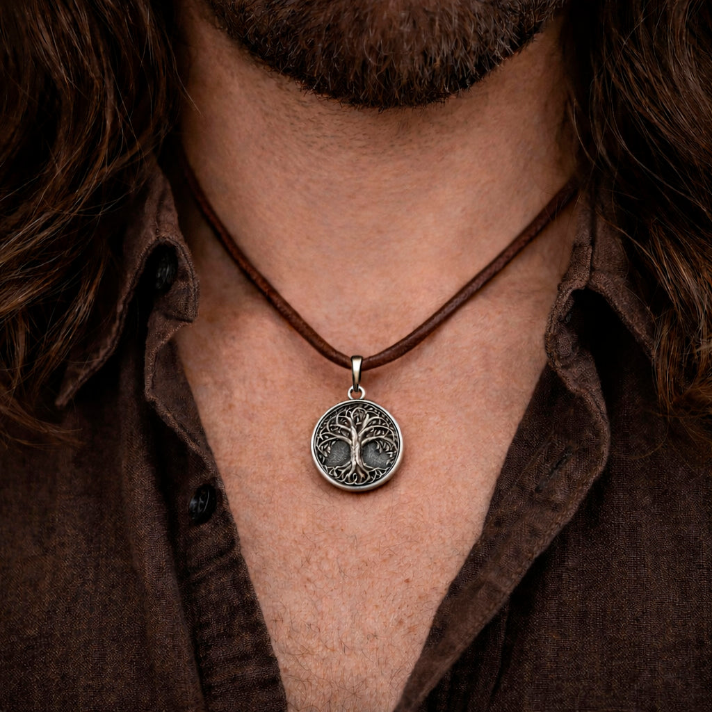 Oxidized silver Tree of Life pendant in 925 sterling silver, inspired by Yggdrasil Norse mythology, round 25mm symbolic Viking necklace, handcrafted Scandinavian jewelry for men, detailed textured background, minimalist mythological silver charm