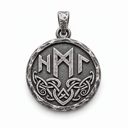Reverse of the silver Hel pendant with raised runic symbols and interwoven knotwork on white. INDIGO Jewelry.
