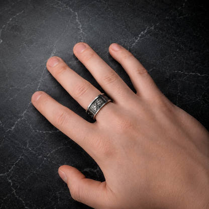 Four Cardinal Virtues sterling silver ring shown on hand for scale