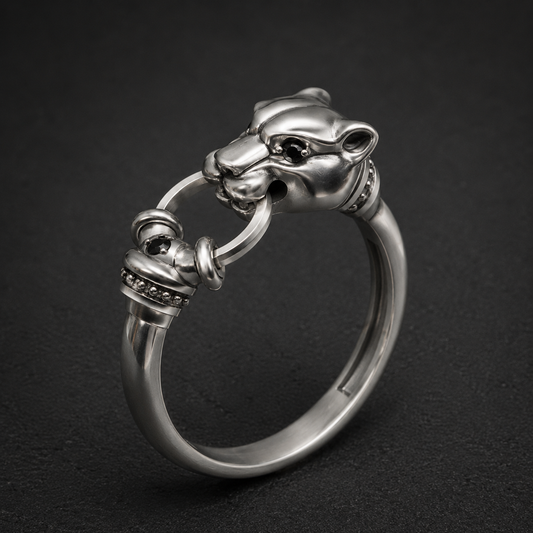 Luxury sterling silver panther ring with black gemstones on premium dark background by Indigo Jewelry