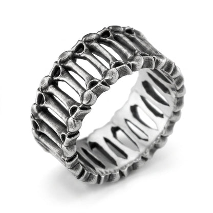 The 'Eternal Bones' ring is a symbol of eternity and the inevitability of time. Its intricate anatomical design embraces the philosophy of Memento Mori, reminding us of life's fragility and the strength of the spirit. A unique sterling silver piece for those who appreciate deep symbolism and bold aesthetics.