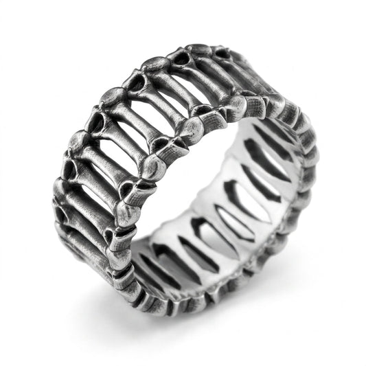 The 'Eternal Bones' ring is a symbol of eternity and the inevitability of time. Its intricate anatomical design embraces the philosophy of Memento Mori, reminding us of life's fragility and the strength of the spirit. A unique sterling silver piece for those who appreciate deep symbolism and bold aesthetics.
