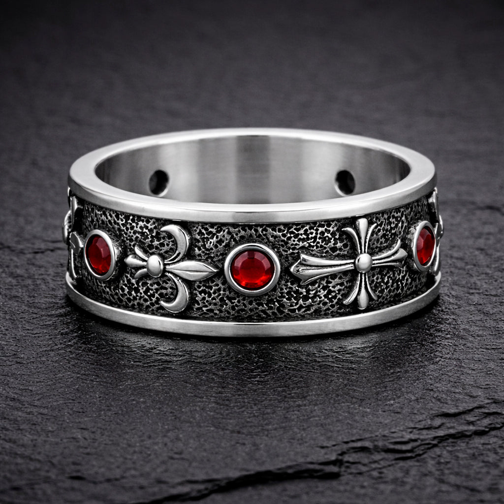 Sterling silver Fleur De Lis ring with deep red garnet stones, featuring an oxidized textured finish and polished heraldic symbols. Medieval gothic band ring inspired by knightly and royal motifs. Solid 925 silver statement ring suitable as a wedding band or symbolic jewelry piece. Elegant, bold, and historically inspired design for men or women, perfect for gothic style, medieval fashion, and unique meaningful gifts.