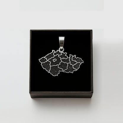 A pendant in the shape of a map of the Czech Republic, displayed in a black box.