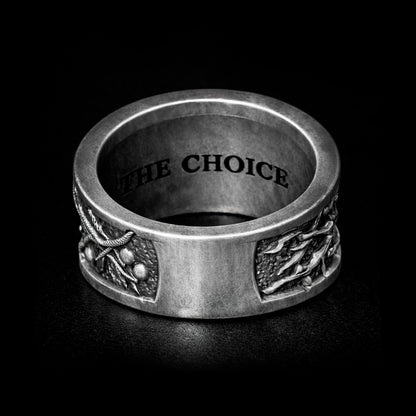 Oxidized sterling silver statement ring by Indigo Jewelry from the Human Paradox Collection. Artistic symbolic design featuring two hands reaching for the forbidden fruit, inspired by Lost Paradise and The Choice concept. Handcrafted silver ring with detailed relief, darkened blackened finish, conceptual jewelry, philosophical ring, art jewelry piece, unique designer silver ring, expressive narrative jewelry, bold textured band, meaningful wearable art.