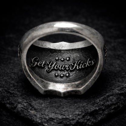 Route 66 sterling silver ring by Indigo Jewelry, men’s biker statement ring crafted from solid 925 silver with oxidized finish. Detailed Route 66 shield engraving with surrounding state names, bold vintage motorcycle jewelry design. Masculine rock style ring inspired by American highway culture, handcrafted silver band for riders, travelers, and lovers of road symbolism.