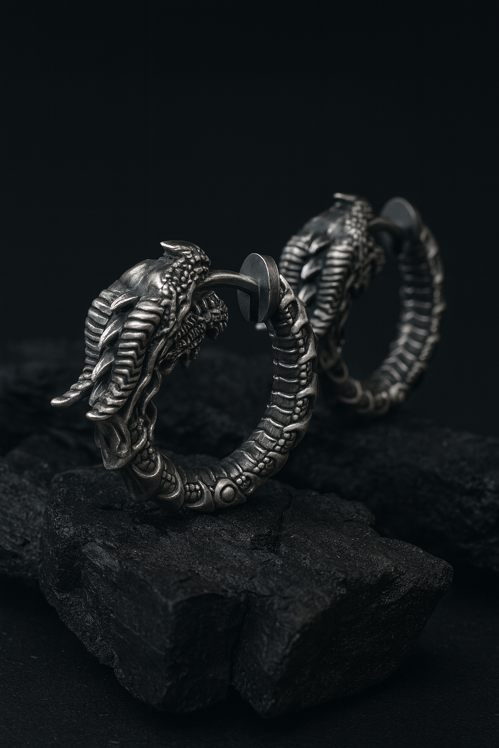 Blackened sterling silver Uroboros dragon hoop earrings with detailed sculpted scales, gothic mythology design, handmade oxidized silver jewelry by INDIGO Jewelry.