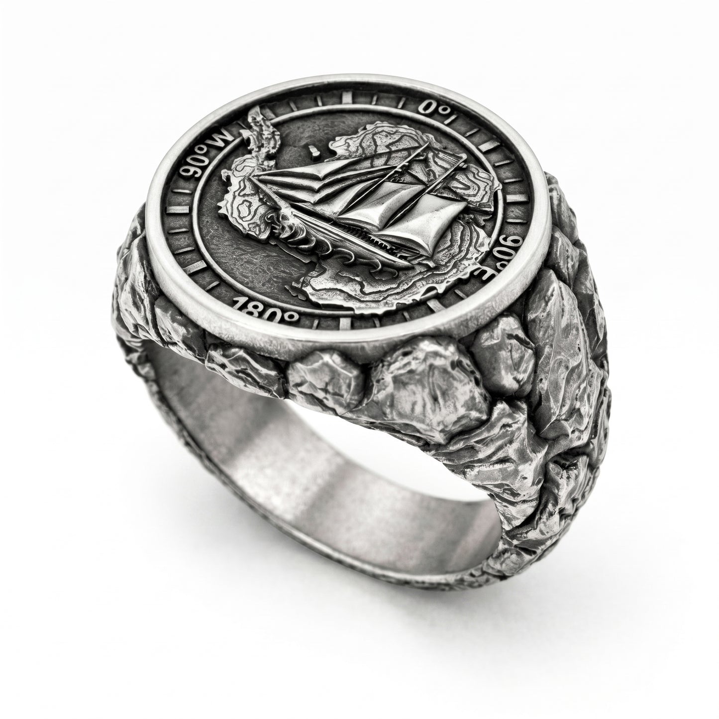 Antarctica explorer signet ring in solid sterling silver 925 featuring a detailed sailing ship over a map of Antarctica, surrounded by directional markings. The ring has a deep oxidized finish with strong contrast, highlighting fine handcrafted textures and relief details. Shot on a dark stone background to emphasize its bold, masculine design, adventure theme, and expedition spirit. Unique nautical jewelry piece inspired by travel, ocean journeys, and exploration beyond the known world.