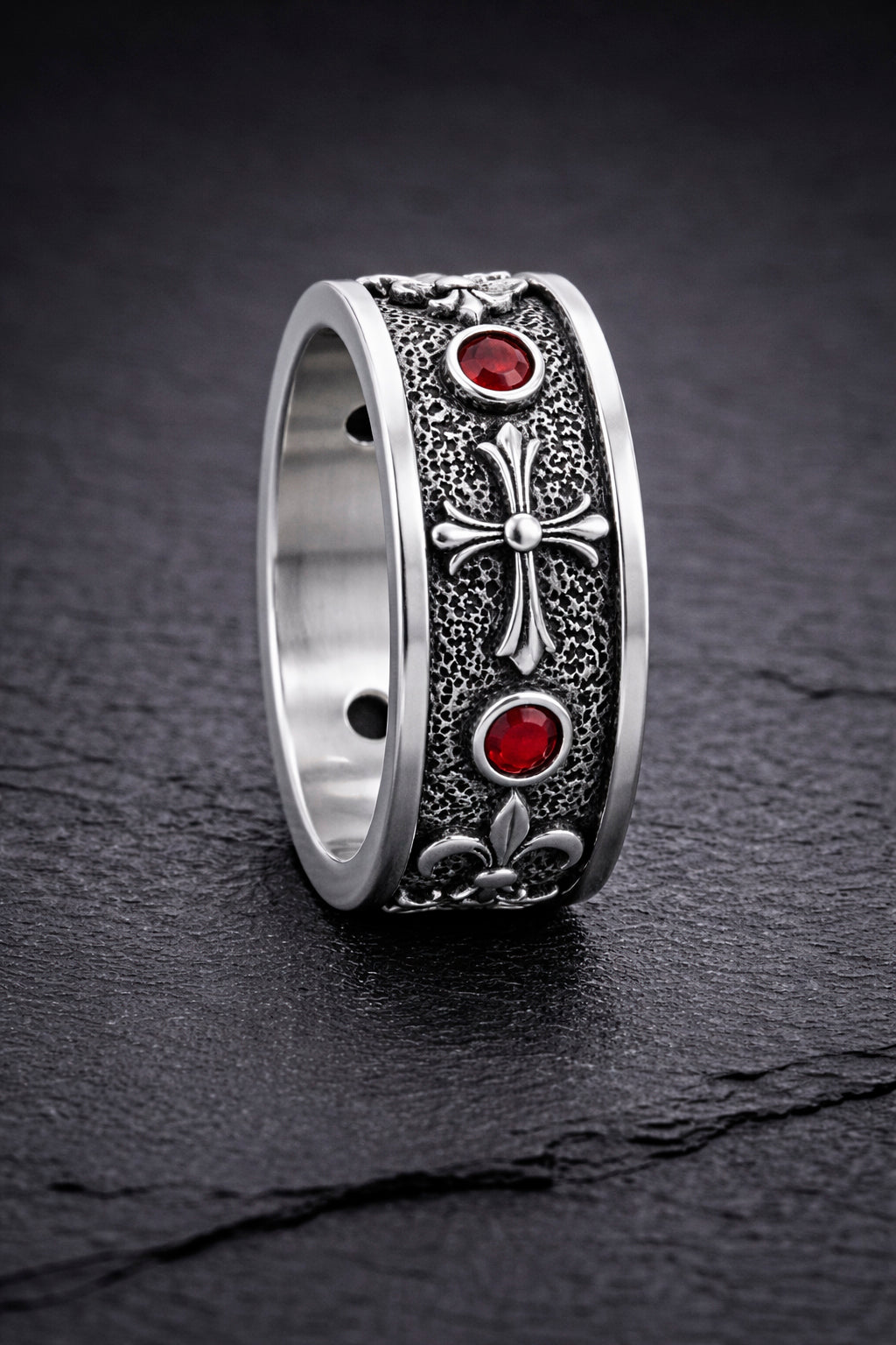 Sterling silver Fleur De Lis ring with deep red garnet stones, featuring an oxidized textured finish and polished heraldic symbols. Medieval gothic band ring inspired by knightly and royal motifs. Solid 925 silver statement ring suitable as a wedding band or symbolic jewelry piece. Elegant, bold, and historically inspired design for men or women, perfect for gothic style, medieval fashion, and unique meaningful gifts.
