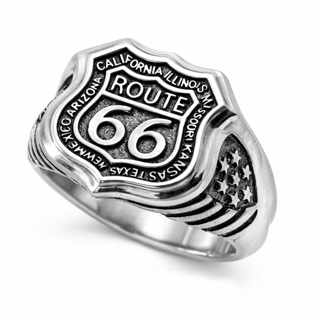 Route 66 sterling silver ring by Indigo Jewelry, men’s biker statement ring crafted from solid 925 silver with oxidized finish. Detailed Route 66 shield engraving with surrounding state names, bold vintage motorcycle jewelry design. Masculine rock style ring inspired by American highway culture, handcrafted silver band for riders, travelers, and lovers of road symbolism.