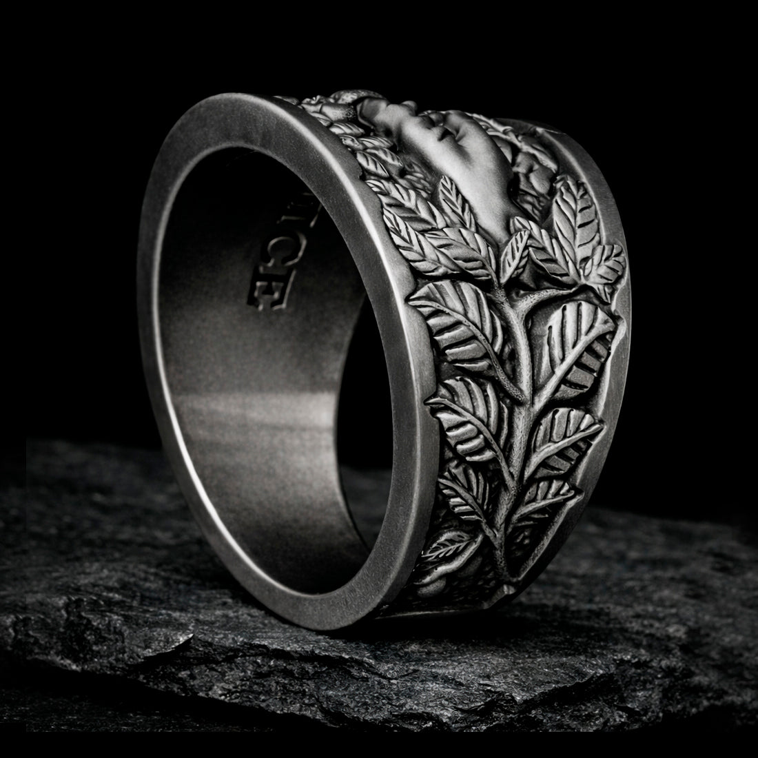 Oxidized sterling silver statement ring by Indigo Jewelry from the Human Paradox Collection. Artistic symbolic design featuring two hands reaching for the forbidden fruit, inspired by Lost Paradise and The Choice concept. Handcrafted silver ring with detailed relief, darkened blackened finish, conceptual jewelry, philosophical ring, art jewelry piece, unique designer silver ring, expressive narrative jewelry, bold textured band, meaningful wearable art.