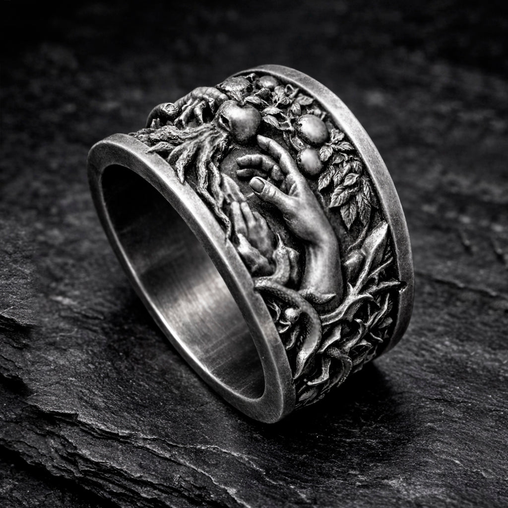 Oxidized sterling silver statement ring by Indigo Jewelry from the Human Paradox Collection. Artistic symbolic design featuring two hands reaching for the forbidden fruit, inspired by Lost Paradise and The Choice concept. Handcrafted silver ring with detailed relief, darkened blackened finish, conceptual jewelry, philosophical ring, art jewelry piece, unique designer silver ring, expressive narrative jewelry, bold textured band, meaningful wearable art.