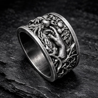 Oxidized sterling silver statement ring by Indigo Jewelry from the Human Paradox Collection. Artistic symbolic design featuring two hands reaching for the forbidden fruit, inspired by Lost Paradise and The Choice concept. Handcrafted silver ring with detailed relief, darkened blackened finish, conceptual jewelry, philosophical ring, art jewelry piece, unique designer silver ring, expressive narrative jewelry, bold textured band, meaningful wearable art.