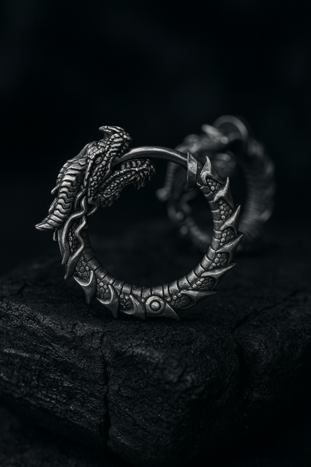 Blackened sterling silver Uroboros dragon hoop earrings with detailed sculpted scales, gothic mythology design, handmade oxidized silver jewelry by INDIGO Jewelry.
