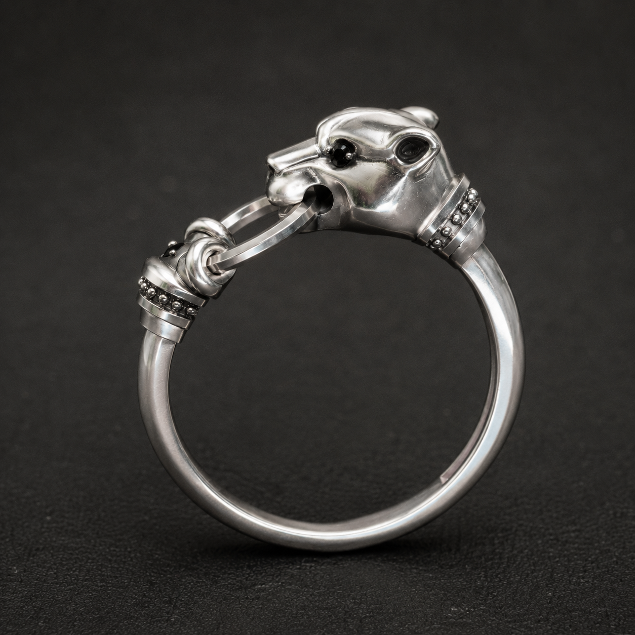 Side view of sterling silver panther head ring with black stones, animal jewelry by Indigo Jewelry