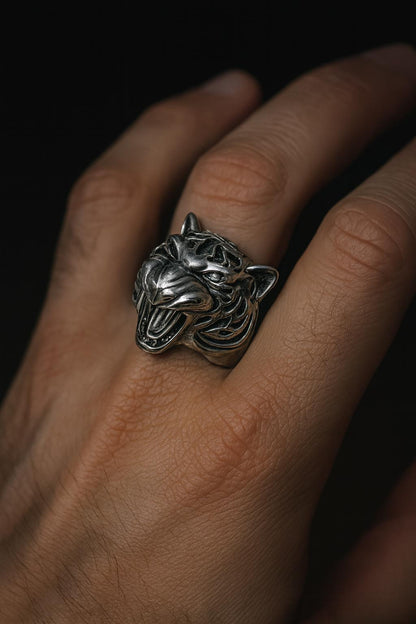 Sterling silver tiger ring with blackened details, handmade gothic biker jewelry for men. This bold 925 silver statement ring features a roaring wild cat head with oxidized textures and polished accents. Perfect as a mens ring, biker ring, or animal ring, it highlights individuality, strength, and fearless style. Crafted from solid silver with a unique oxidized silver patina, durable and stylish for daily wear or special occasions.