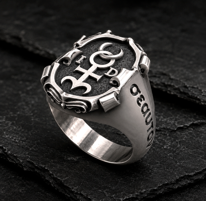 Handcrafted Monas Hieroglyphica signet ring in blackened sterling silver with polished accents on dark slate background by INDIGO Jewelry