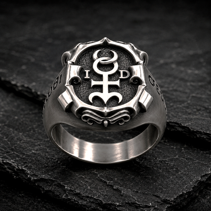 Front view of Monas Hieroglyphica sterling silver signet ring with oxidized finish and Hermetic symbol on dark stone background