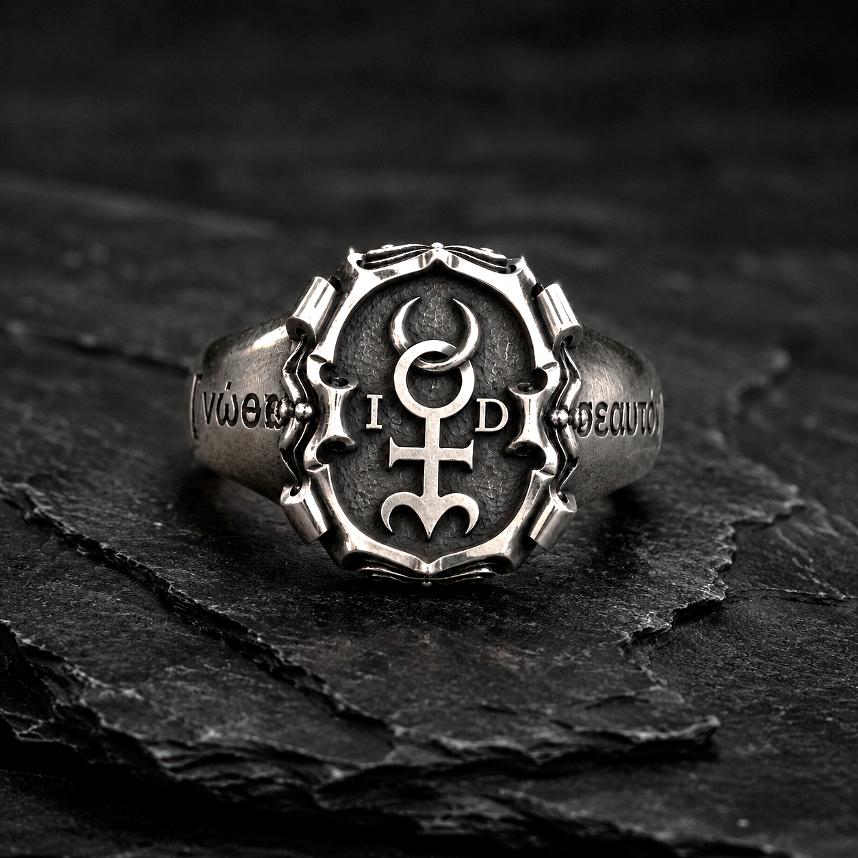 Men’s Monas Hieroglyphica signet ring in oxidized sterling silver worn on hand with polished Hermetic symbol details