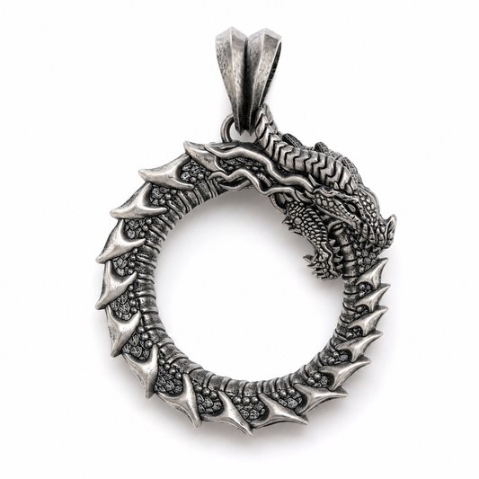 Handcrafted Ouroboros dragon pendant in oxidized sterling silver 925 by INDIGO Jewelry. Detailed dragon necklace inspired by ancient mythology, photographed on a clean white background. Symbolic silver pendant representing eternity and transformation.
