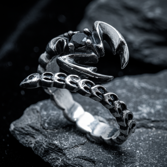 Adjustable Scorpio zodiac ring worn on a man's pinky finger in sterling silver