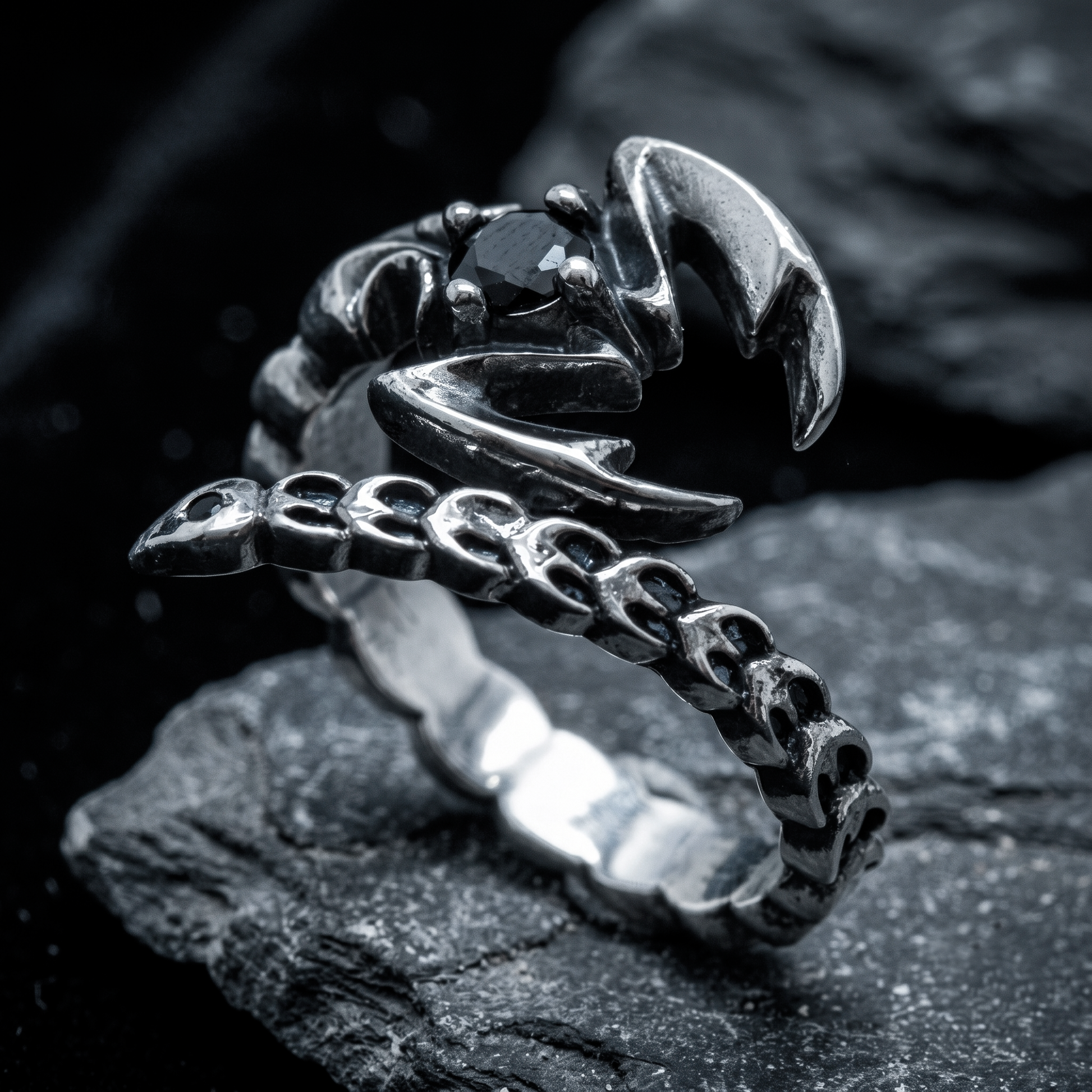 Adjustable Scorpio zodiac ring worn on a man's pinky finger in sterling silver
