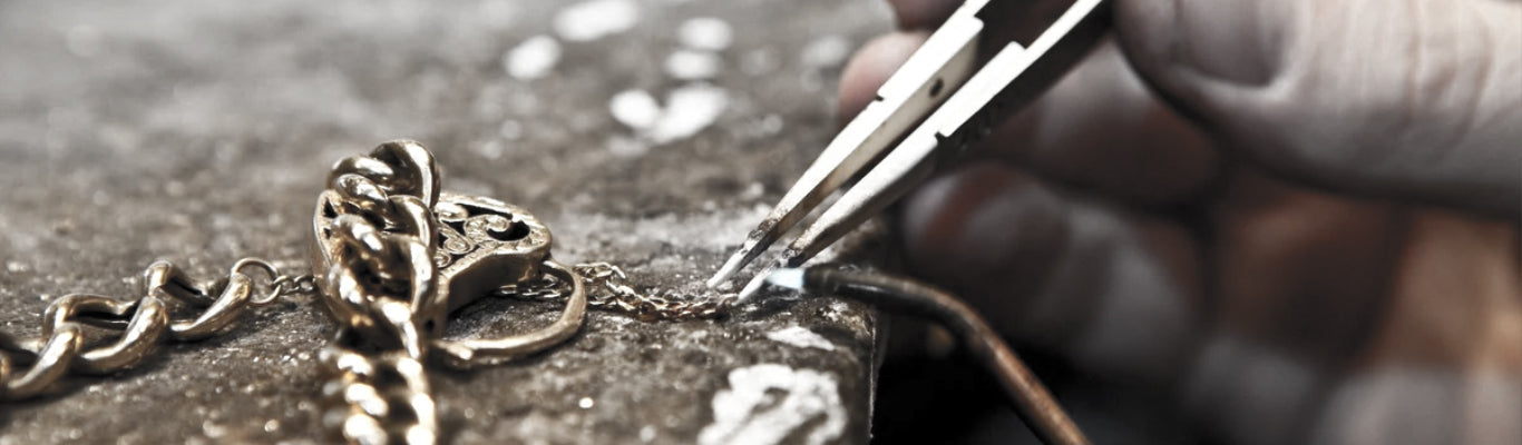 Professional silver jewelry repair service including chain soldering, ring restoration and broken necklace repair by INDIGO Jewelry workshop in Europe