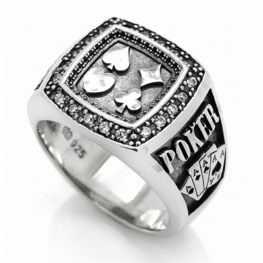 Men's sterling silver poker signet ring showcasing four card suits and embedded stones on a premium black background by Indigo Jewelry.