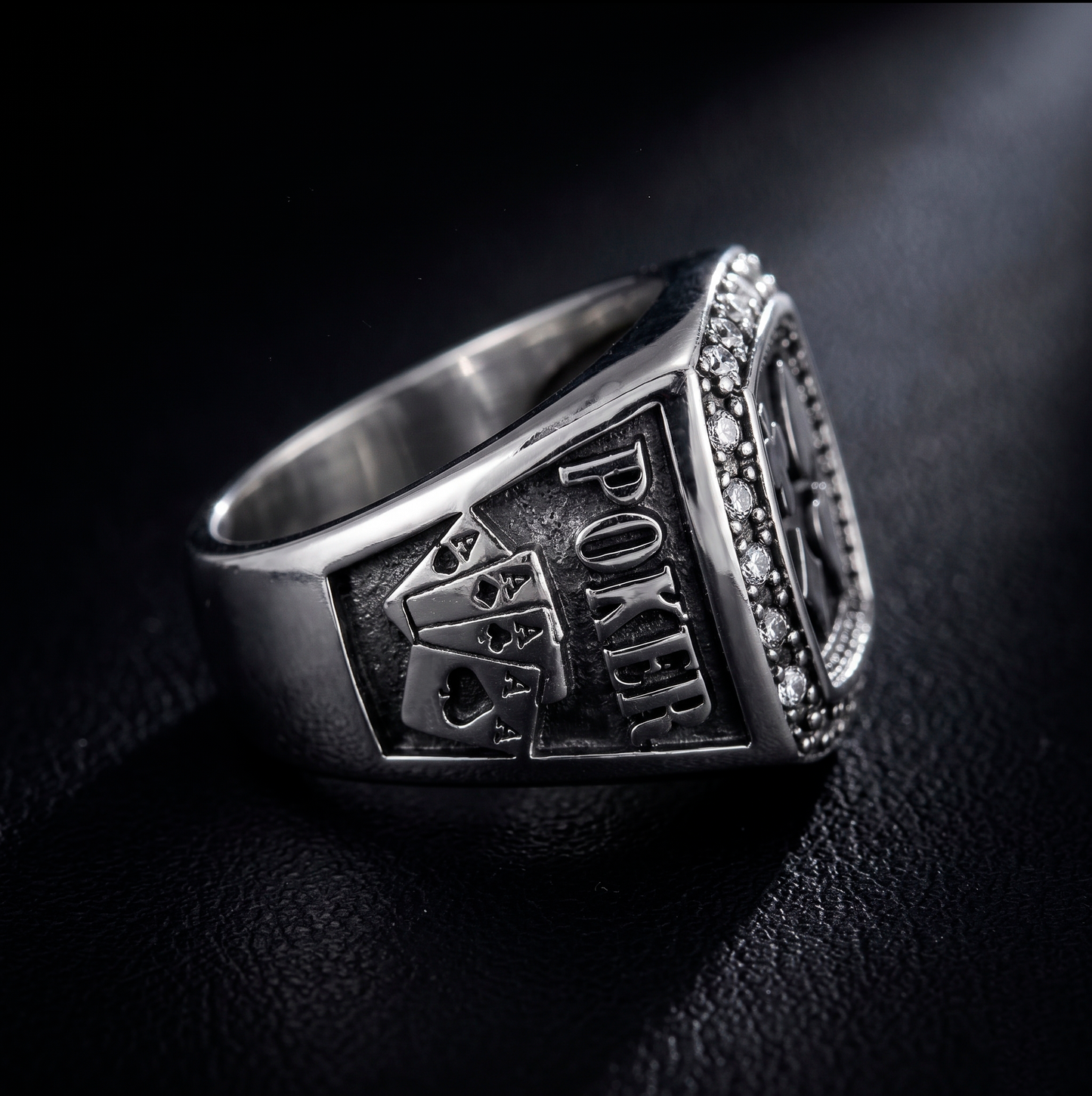 Side profile of the men's silver poker ring detailing four engraved aces and the Poker inscription by Indigo Jewelry