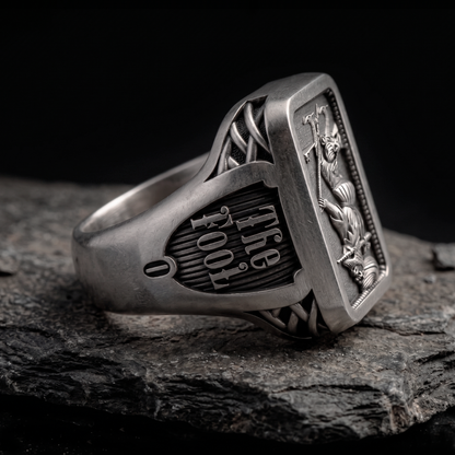 Side view of The Fool Tarot silver signet ring by INDIGO Jewelry Atelier with engraved tarot symbolism and oxidized finish