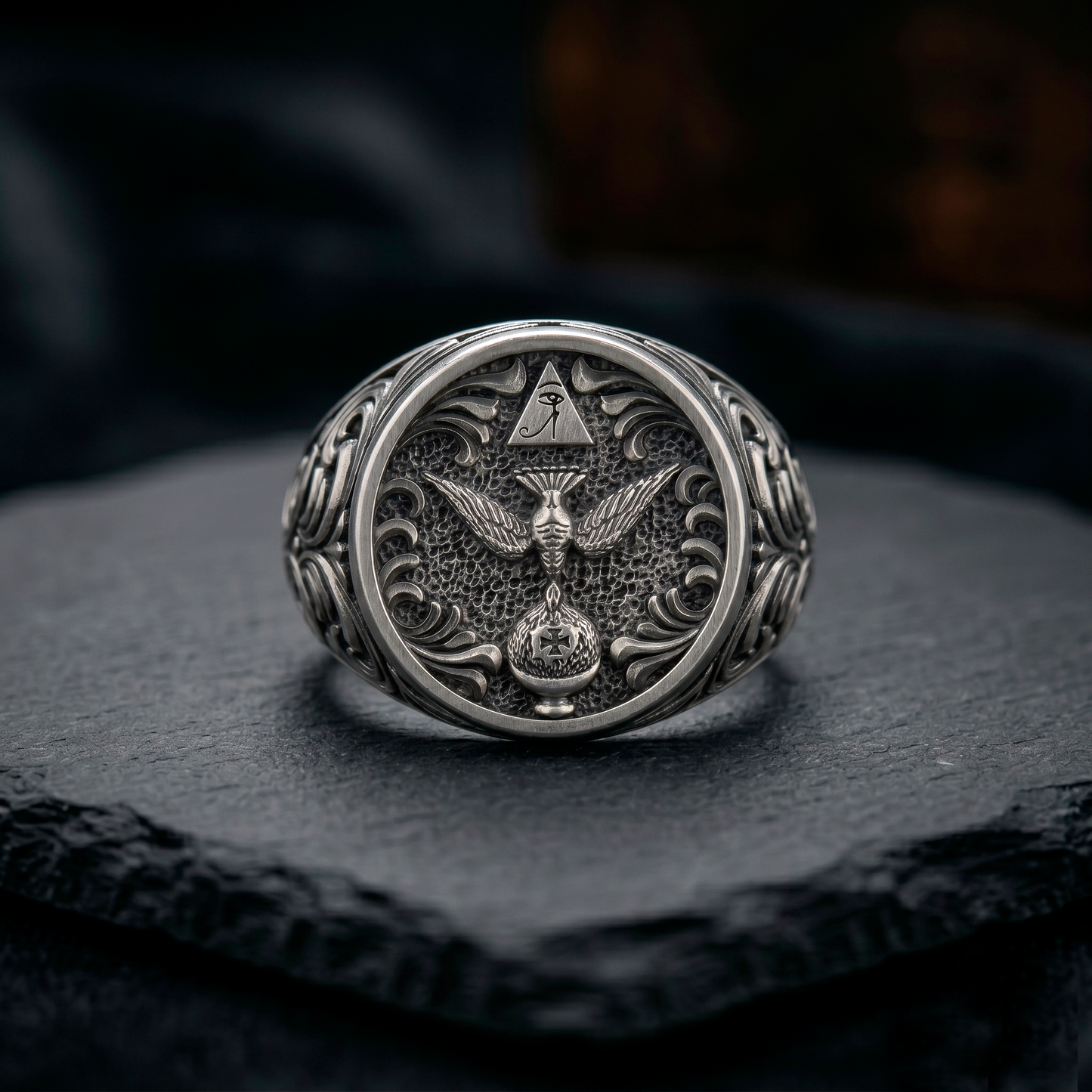 Thelema OTO sterling silver signet ring displayed on dark stone background, oxidized mens occult jewelry, INDIGO Jewelry Atelier
