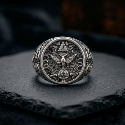 Thelema OTO sterling silver signet ring displayed on dark stone background, oxidized mens occult jewelry, INDIGO Jewelry Atelier