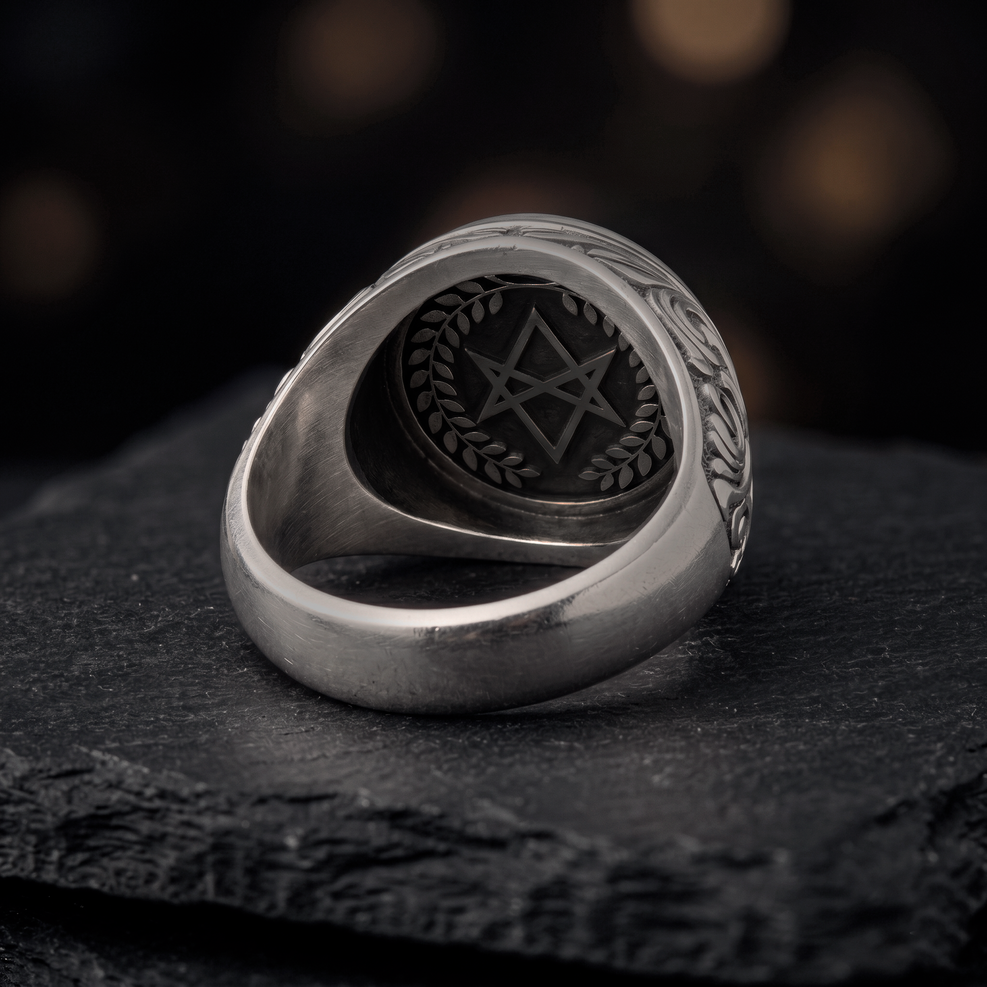 Inside view of handcrafted Thelema signet ring with polished inner band and oxidized silver finish, INDIGO Jewelry Atelier