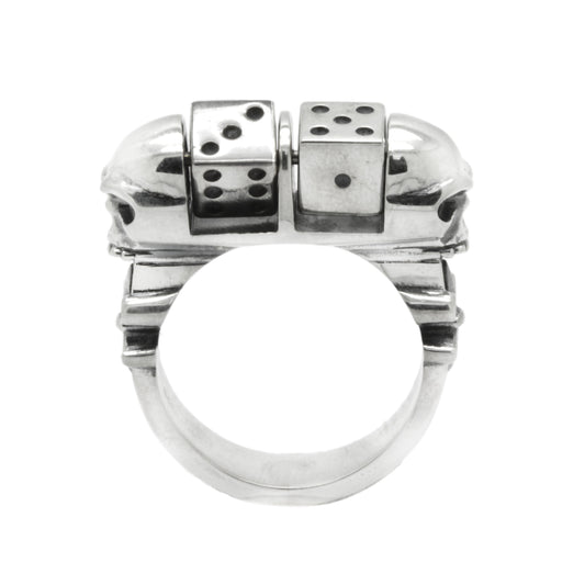 Handcrafted unisex skull ring made of 925 sterling silver, featuring a detailed skull design with a pair of dice on each side. This gothic-style statement ring symbolizes luck, risk, and bold individuality. Suitable for men and women, it blends biker and dark fashion aesthetics. The oxidized and polished silver surface adds depth and character. A perfect lucky charm and gift for fans of edgy jewelry.